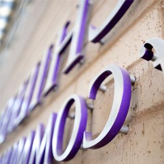 Close up photo of raised purple building signage